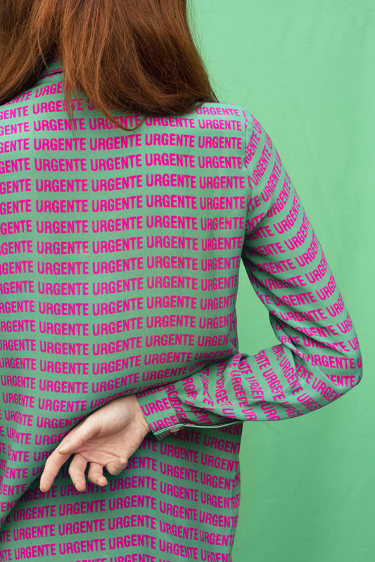 Luana Ga' Urgente silk shirt.It has a green background colour with a shocking pink Urgente type.